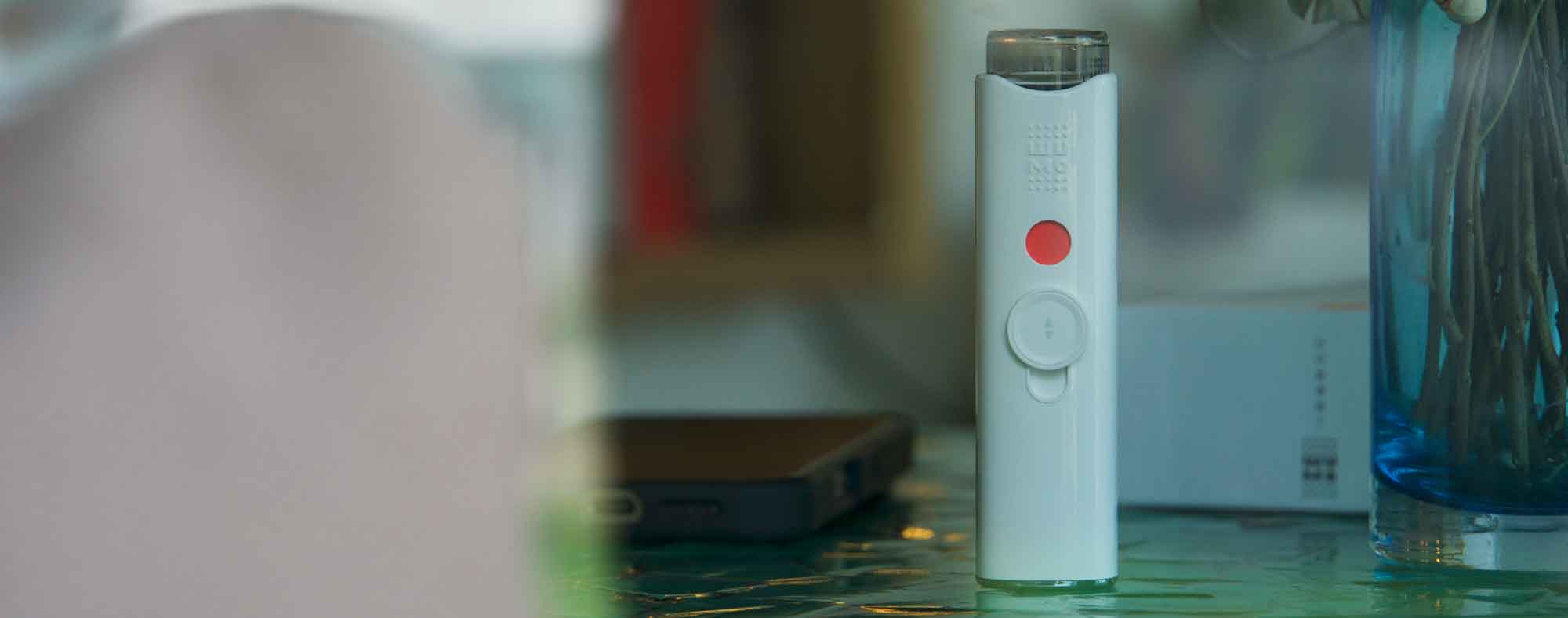 A-person-safely-parked-in-their-car,-using-a-wumo-eye-hydrator-to-refresh-their-eyes-before-continuing-their-journey